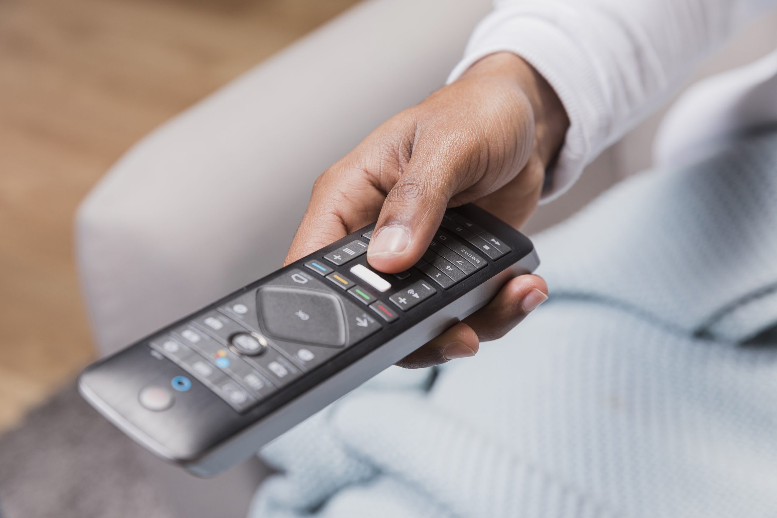 close-up-man-holding-remote
